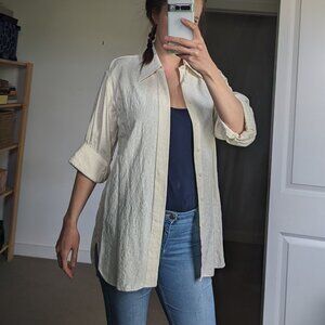 Off-white long-sleeve shirt with a monochromatic floral pattern